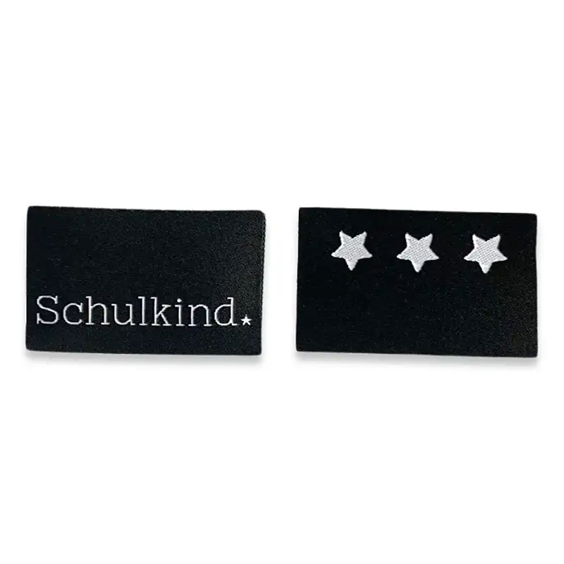 eblabel in schwarz eines mit weißer Aufschrift unten "Schulkind" und 1 Weblabel in schwarz mit weißer Abbildung von 3 Sternen oben